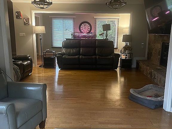 Sunroom through living- den