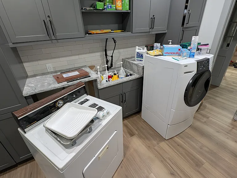Laundry room with available washer and dryer.