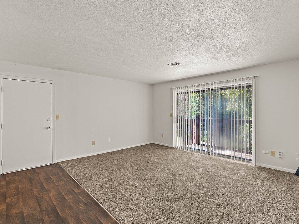 Carpeted Living Room with Large Window