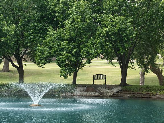 View of home's community featuring view of golf course