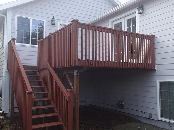 Back deck accessible from kitchen and master bedroom