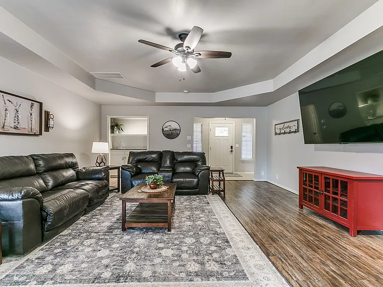 Comfortable living room with huge 85 inch TV