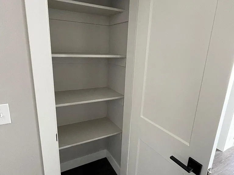 Small pantry closet in the kitchen for extra food storage