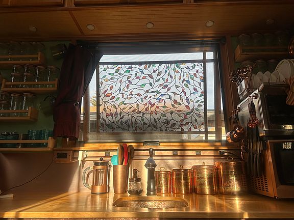 On a sunny day the stained glass effect of the window and the copper accents are illuminated!