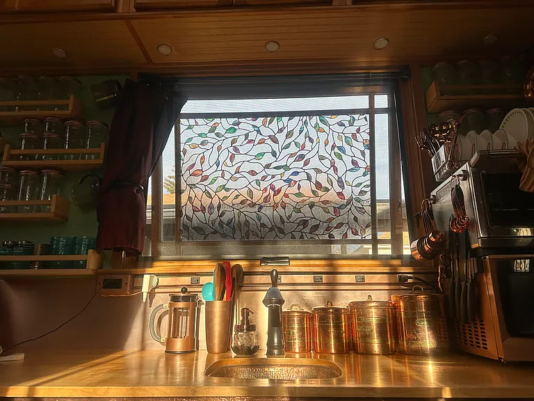On a sunny day the stained glass effect of the window and the copper accents are illuminated!