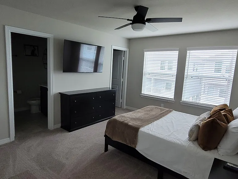 Upstairs guest room with queen size bed and en suite bath.
