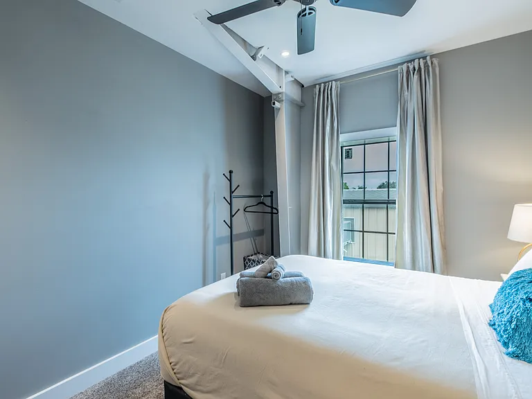 Bright and modern bedroom with stylish abstract decor.