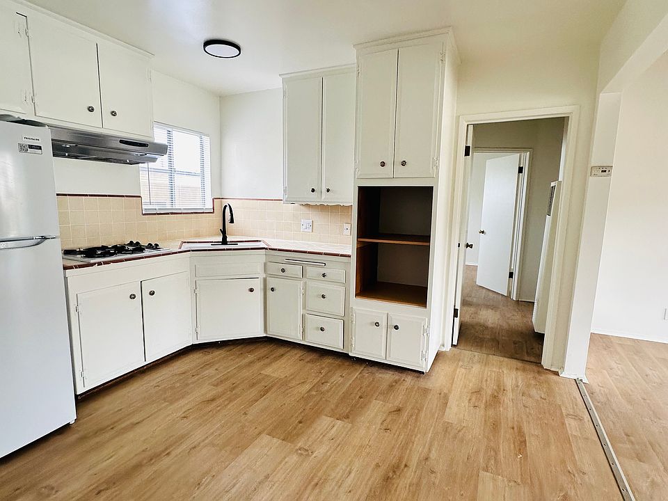 spacious kitchen with brand new family sized ref.