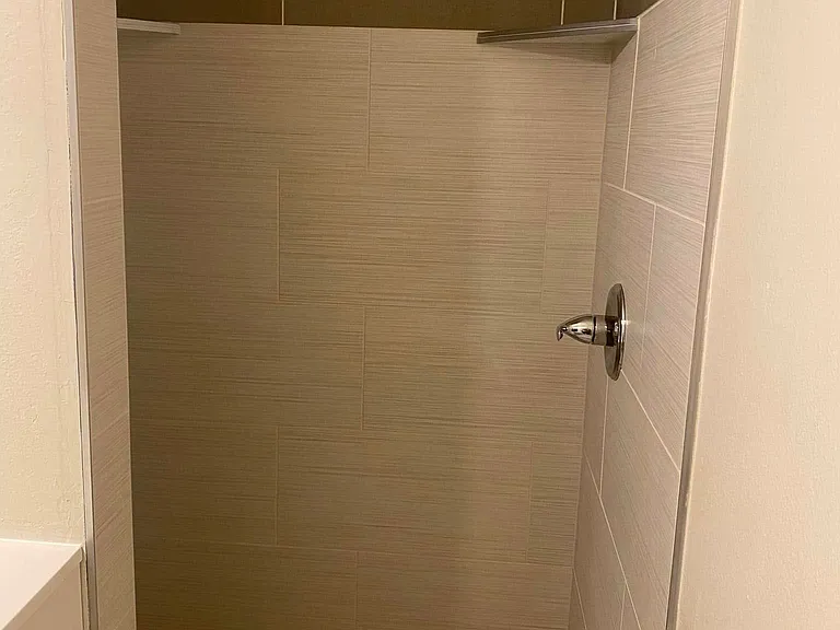 Updated and enlarged master shower.