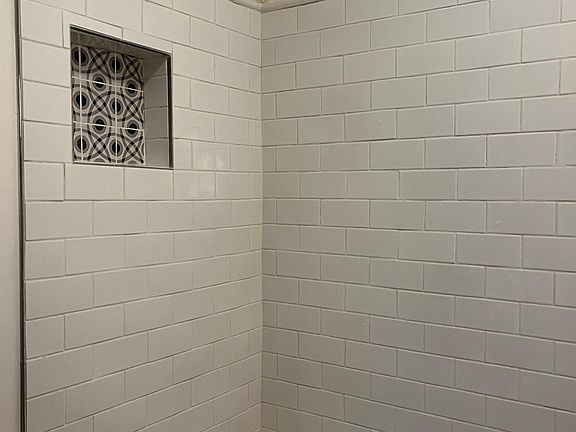 Freshly tiled shower and tub
