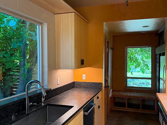 Kitchen with mud room in the back.