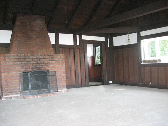 Living room with 14' Cathedral Ceiling and entrance to hallway to bedrooms/bathroom/washer/dryer/storeroom/workroom/home office work space, etc...