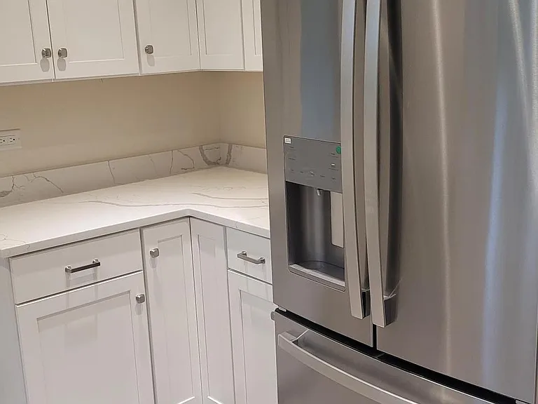 Partial Kitchen view with self-closing doors/drawers