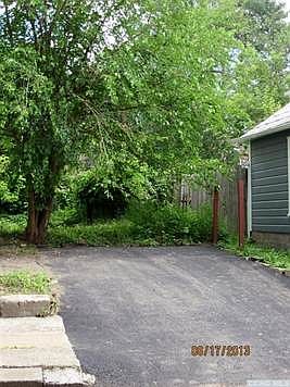 At the rear of the back yard is a newly paved off-street parking spot under your mature shade tree.The area will be fenced soon.