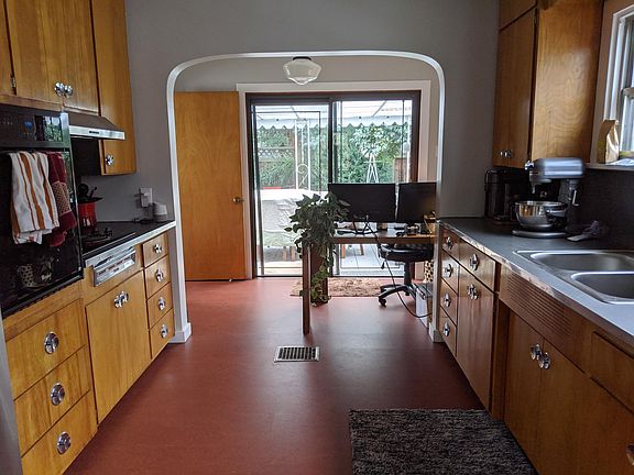 Kitchen with lots of storage and space for a dining table or desk