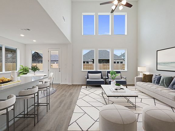 Two story family room. Note Sample product photo - actual exterior and interior selections may vary