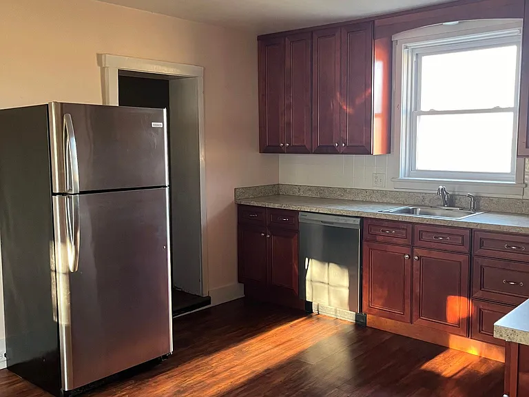 Kitchen large walk-in pantry right side of refrigerator