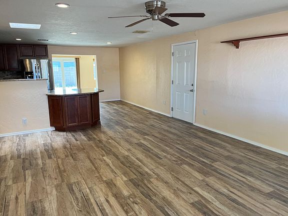Tile floors throughout living space and bathrooms. Open concept through to Arizona room and sliding glass door to backyard!