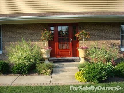Front Entry
						:
						landscaping welcomes you with brick lined sidewalk