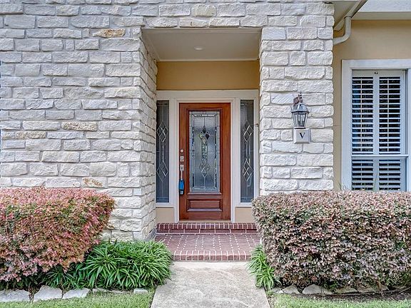 Your entry door. There are sprinklers in the front flower beds.