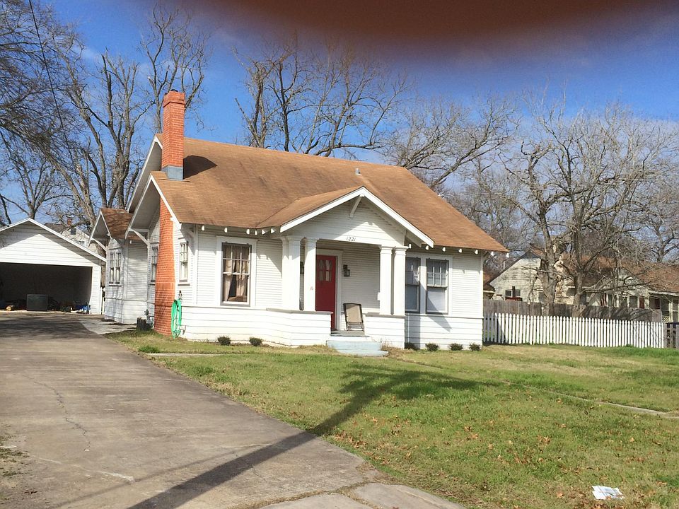 Front of house from street, garage left rear