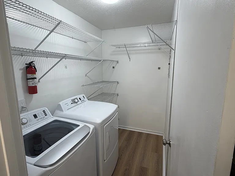 Large laundry space with plenty of additional storage.