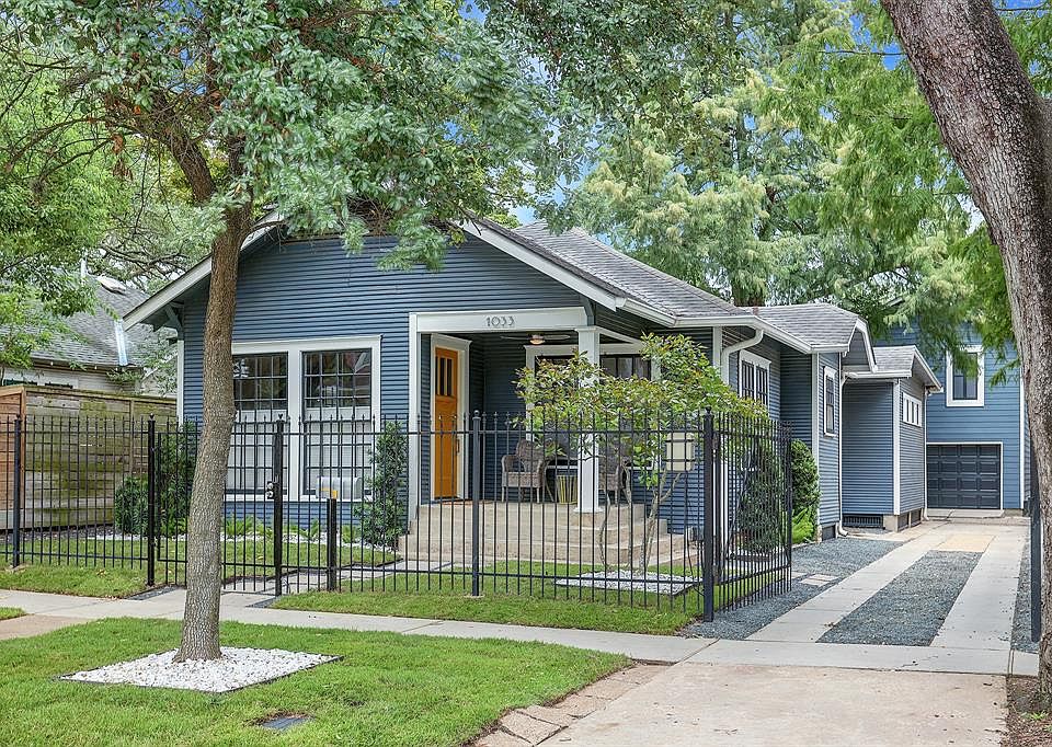 1033 E 7TH ST: This craftsman-style bungalow with garage apartment, exudes style while keeping true to the Heights period. Professionally landscaped, fully fenced with electric gate, and more!