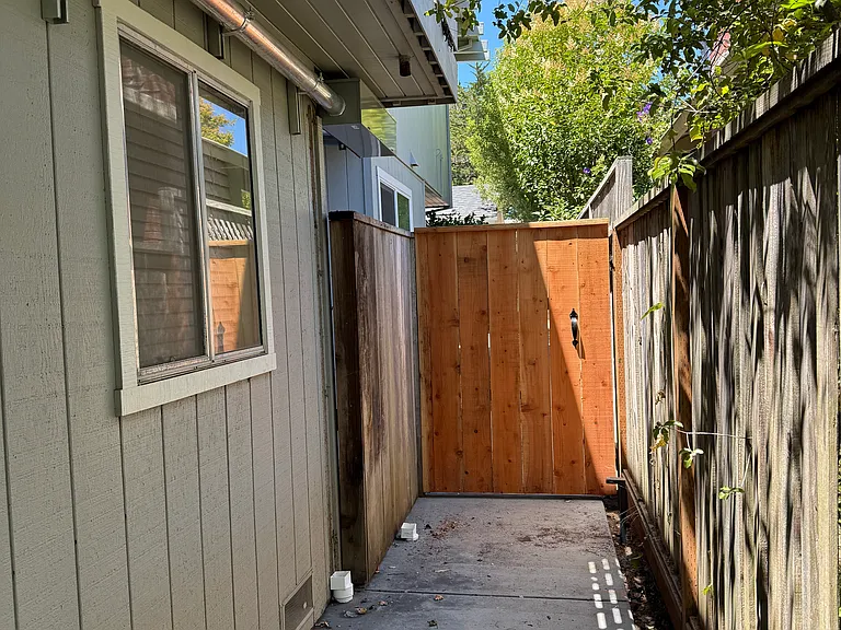 Gate alongside main house leading to your own private entrance