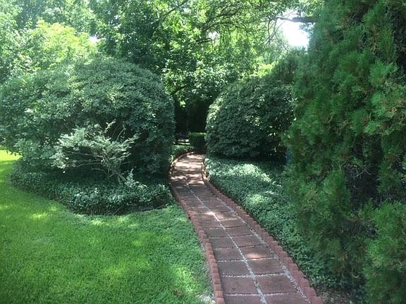Path to Unit C-floodlights and motion activated footlights illuminate the path after dark