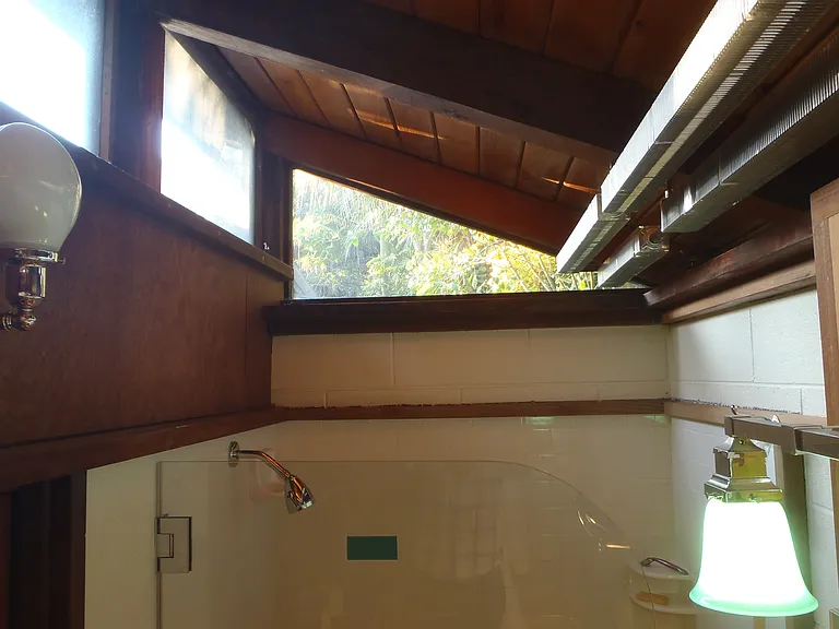 Clerestory windows make this shower and WC space light-filled