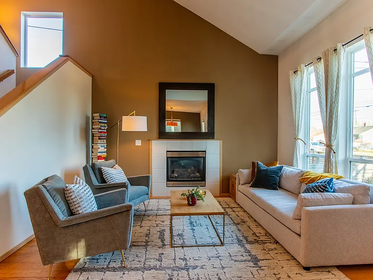 Living room and staircase - vaulted ceilings and windows on all sides of the house