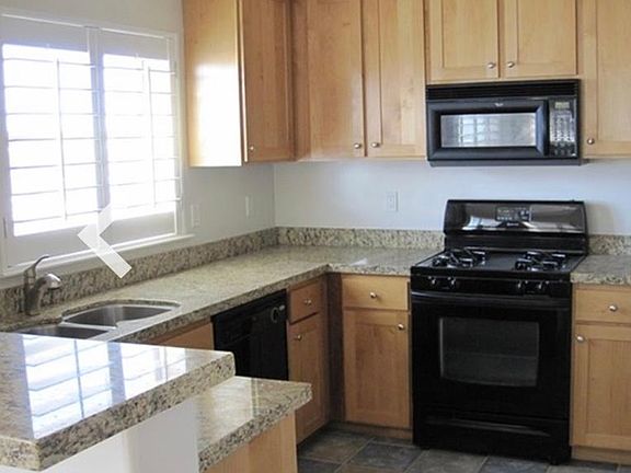 kitchen with window views and pantry