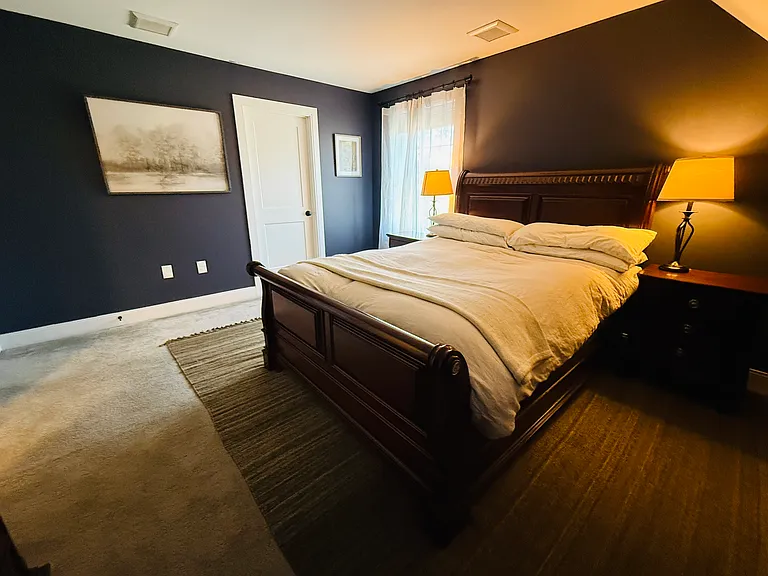 Master bedroom. Attached bathroom door shown on the left.