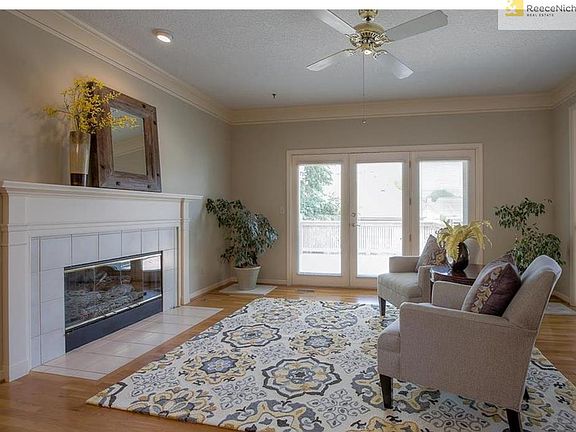 Cozy hearth room opens to deck.