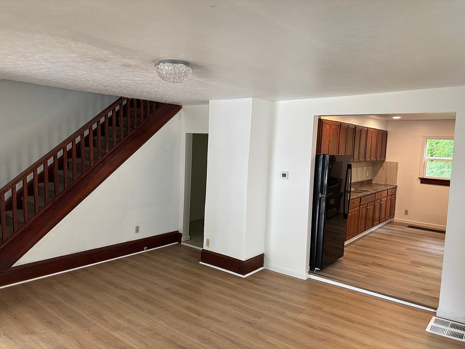 Front Living room connecting to kitchen and dining room