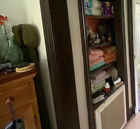 Storage outside bathroom 