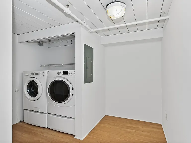 Renovated in-unit laundry with front facing machines