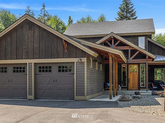 Barely viewable from the road, the fully paved drive with extra parking space beckons you to this lovely retreat.