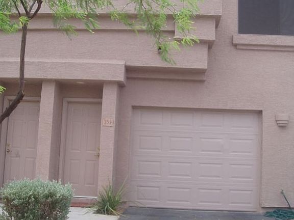 outside of condo with garage below 