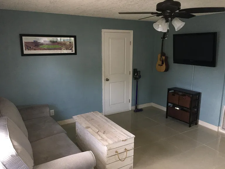 Lower Level Office/Family Room. Door leads to garage.