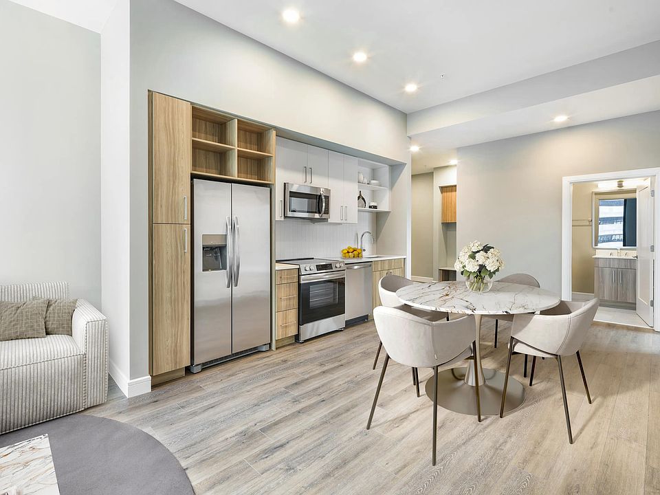Contemporary kitchens feature stainless steel appliances, quartz countertops, open shelving, and curated finishes designed to suit your lifestyle.