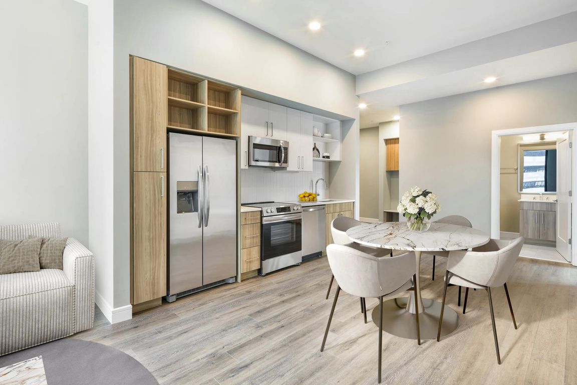 Contemporary kitchens feature stainless steel appliances, quartz countertops, open shelving, and curated finishes designed to suit your lifestyle.