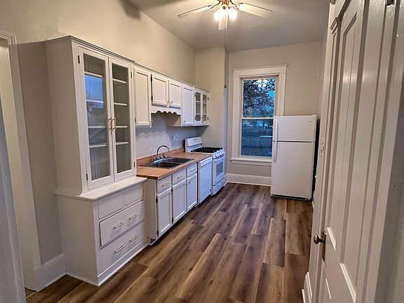 Kitchen with gas range, refrigerator, dishwasher, and original built-ins