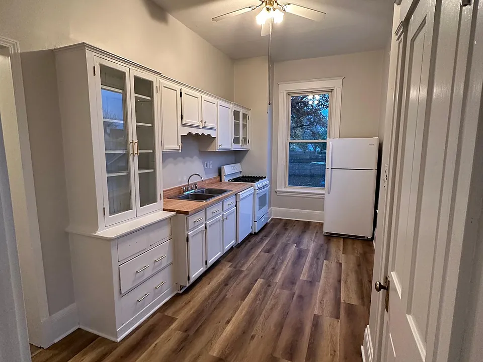 Kitchen with gas range, refrigerator, dishwasher, and original built-ins
