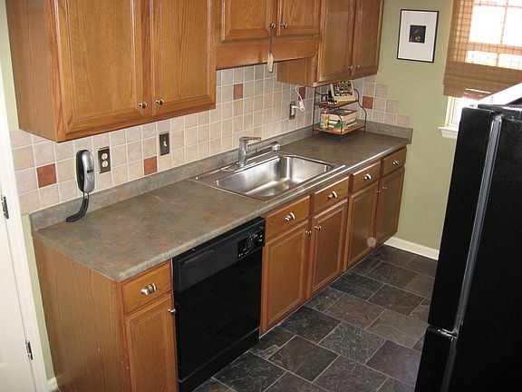 kitchen w/ real slate floor and tile backspash.