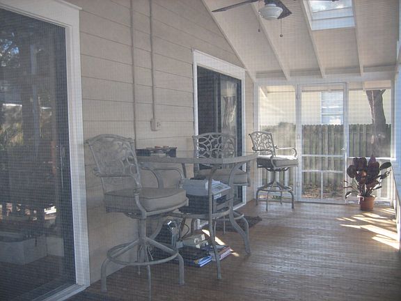 Both bedrooms open to the beautiful screened back porch.