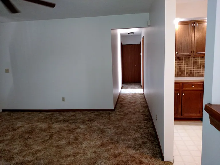 Looking from kitchen into hallway to bedrooms.