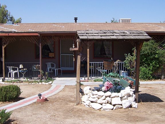 Front of home with wishing well