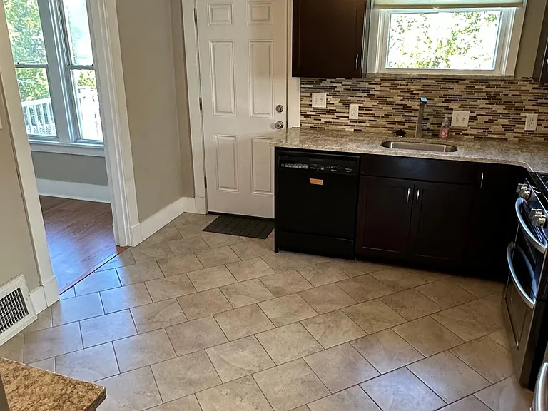 Updated kitchen with quartz countertops, stainless appliances, including a double oven!