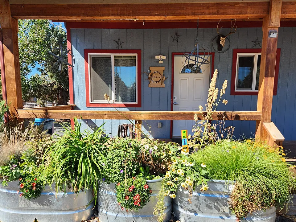 Front porch and main entrance. Planters with maintenance provided